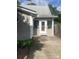 Exterior view of back entrance with a concrete patio and plants at 328 E Center Ave, Mooresville, NC 28115