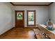 Dining room featuring wood floors, a farmhouse style table, and natural light from a nearby window at 328 E Center Ave, Mooresville, NC 28115