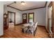 Dining room with hardwood floors, natural light, and a rustic dining table and bench at 328 E Center Ave, Mooresville, NC 28115