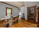 Bright dining room features hardwood floors and a rustic table and chairs at 328 E Center Ave, Mooresville, NC 28115