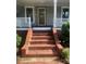 Close-up of front entrance with brick steps and classic architectural details at 328 E Center Ave, Mooresville, NC 28115