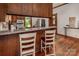 Modern kitchen with wood cabinets, granite countertops, and stainless steel appliances at 328 E Center Ave, Mooresville, NC 28115