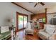 Bright living room with a view of the kitchen, a sliding glass door, and comfortable seating at 328 E Center Ave, Mooresville, NC 28115