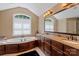 Relaxing bathroom with soaking tub, dual sinks, and granite countertops at 335 Whisper Lake Dr, New London, NC 28127