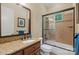 Elegant bathroom with granite countertop, tiled shower, and modern fixtures at 335 Whisper Lake Dr, New London, NC 28127