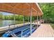View of a covered boat lift on a private dock, offering convenience for waterfront activities at 335 Whisper Lake Dr, New London, NC 28127