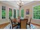 Elegant dining room featuring hardwood floors and doors leading to the outdoor area at 335 Whisper Lake Dr, New London, NC 28127