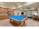 Spacious recreation room with pool table, kitchenette, and cozy seating area at 335 Whisper Lake Dr, New London, NC 28127