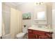 Bathroom with shower, toilet, vanity and a decorative mirror at 363 Bellingrath Blvd, Rock Hill, SC 29730