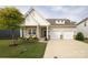 Charming two-story home boasts a well-manicured lawn, stone accents, and a convenient two-car garage at 363 Bellingrath Blvd, Rock Hill, SC 29730