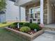 Inviting front porch with stone accents, comfortable seating, and beautifully landscaped garden, offering a charming curb appeal at 363 Bellingrath Blvd, Rock Hill, SC 29730