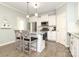 Cozy kitchen featuring granite counters, stainless appliances and a kitchen island with barstool seating at 363 Bellingrath Blvd, Rock Hill, SC 29730