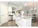 Open kitchen featuring white cabinets, stainless steel appliances, granite counters, an island, and access to the dining room at 363 Bellingrath Blvd, Rock Hill, SC 29730