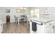 Stylish kitchen with gray chairs, granite countertops, stainless appliances, and an island next to a dining area at 363 Bellingrath Blvd, Rock Hill, SC 29730