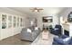 Relaxing living room boasts stylish decor, built-in shelving, and plenty of natural light at 363 Bellingrath Blvd, Rock Hill, SC 29730