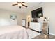 Comfortable bedroom featuring hardwood floors, neutral walls, a ceiling fan, and two dressers with a large mirror at 363 Bellingrath Blvd, Rock Hill, SC 29730