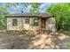 A single-story home with siding, porch, and a spacious backyard, ready for your vision at 3924 Tillman Rd, Charlotte, NC 28208