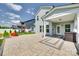 View of a backyard patio with seating, a well-maintained lawn, and privacy fencing at 4023 Spring Garden St, Fort Mill, SC 29715