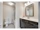 Bright bathroom features a vanity with dark cabinets, a shower-tub combo, and a tiled floor at 4023 Spring Garden St, Fort Mill, SC 29715