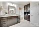 Granite countertop bathroom featuring dark cabinets, stainless steel hardware, and modern fixtures at 4023 Spring Garden St, Fort Mill, SC 29715