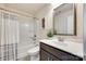 Clean bathroom showcases a tub-shower combination, vanity with updated plumbing fixtures and a mirror at 4023 Spring Garden St, Fort Mill, SC 29715