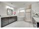 Bright bathroom featuring dark cabinets, a soaking tub and a glass shower at 4023 Spring Garden St, Fort Mill, SC 29715