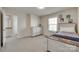 Neutral bedroom boasts a sporty decor with a bed and dresser illuminated by natural light at 4023 Spring Garden St, Fort Mill, SC 29715