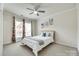 Bright bedroom with a neutral color palette, ceiling fan, and large windows at 4023 Spring Garden St, Fort Mill, SC 29715