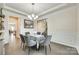 Well-lit dining room featuring decorative trim, hardwood floors, and seamless access to other living spaces at 4023 Spring Garden St, Fort Mill, SC 29715