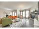 Spacious living room with a fireplace, large windows, and stylish furnishings at 4023 Spring Garden St, Fort Mill, SC 29715