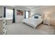 Comfortable main bedroom featuring a tray ceiling, a large bed and bright natural light at 4023 Spring Garden St, Fort Mill, SC 29715