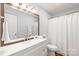 Bathroom featuring a large framed mirror and shower at 405 W Ormand Ave, Bessemer City, NC 28016