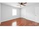 Bedroom with ceiling fan and hardwood floors at 405 W Ormand Ave, Bessemer City, NC 28016