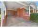 Charming brick carport featuring a covered entry, providing convenience and protection from the elements at 405 W Ormand Ave, Bessemer City, NC 28016