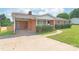 Beautiful brick home featuring a carport, covered entry, and well-maintained landscaping at 405 W Ormand Ave, Bessemer City, NC 28016