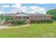 Beautiful brick house with a covered front porch and well-maintained landscaping at 405 W Ormand Ave, Bessemer City, NC 28016