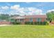 Brick home featuring manicured lawn and shuttered windows, presenting a blend of classic charm and curb appeal at 405 W Ormand Ave, Bessemer City, NC 28016