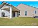 This backyard has a covered patio, with a well-manicured lawn, and is great for outdoor living and entertaining at 4243 Merrivale Dr, Lancaster, SC 29720