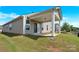 Well-maintained backyard featuring a covered patio and lush green lawn, perfect for relaxation and outdoor enjoyment at 4243 Merrivale Dr, Lancaster, SC 29720