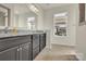 Bathroom featuring a granite countertop vanity, a large mirror, and ceramic tile flooring at 4243 Merrivale Dr, Lancaster, SC 29720