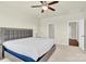 Bedroom showcases a ceiling fan, neutral walls, carpet, and ample closet space for storage and organization at 4243 Merrivale Dr, Lancaster, SC 29720