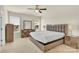 Bright bedroom with neutral walls, carpet, a ceiling fan, and large windows overlooking the lawn at 4243 Merrivale Dr, Lancaster, SC 29720