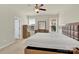 Bright bedroom features neutral walls, carpet, a ceiling fan, and matching furniture including dresser and nightstands at 4243 Merrivale Dr, Lancaster, SC 29720