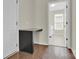 Hallway desk nook with granite countertop and hardwood floors next to the laundry room at 4243 Merrivale Dr, Lancaster, SC 29720