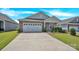 Charming single-story home with a two car garage and a well-manicured front yard under a blue sky at 4243 Merrivale Dr, Lancaster, SC 29720