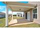 Covered patio with a lush green lawn, offering a serene outdoor space for relaxation and enjoyment at 4243 Merrivale Dr, Lancaster, SC 29720