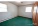 Simple bedroom with natural light from two windows, awaiting personalization and decor at 4268 Wilkesboro Hwy, Statesville, NC 28625