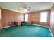 Bright office space features wood paneled walls, green carpet, and an L-shaped wooden desk at 4268 Wilkesboro Hwy, Statesville, NC 28625