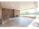 Spacious covered patio with brick accents, perfect for outdoor gatherings and relaxation at 4268 Wilkesboro Hwy, Statesville, NC 28625