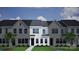 New construction townhome showcasing modern design, attractive landscaping, and inviting curb appeal in a desirable neighborhood at 4706 Lakeview Rd # 9, Charlotte, NC 28216